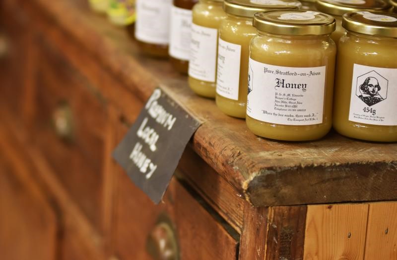 An image showing honey on a shelf