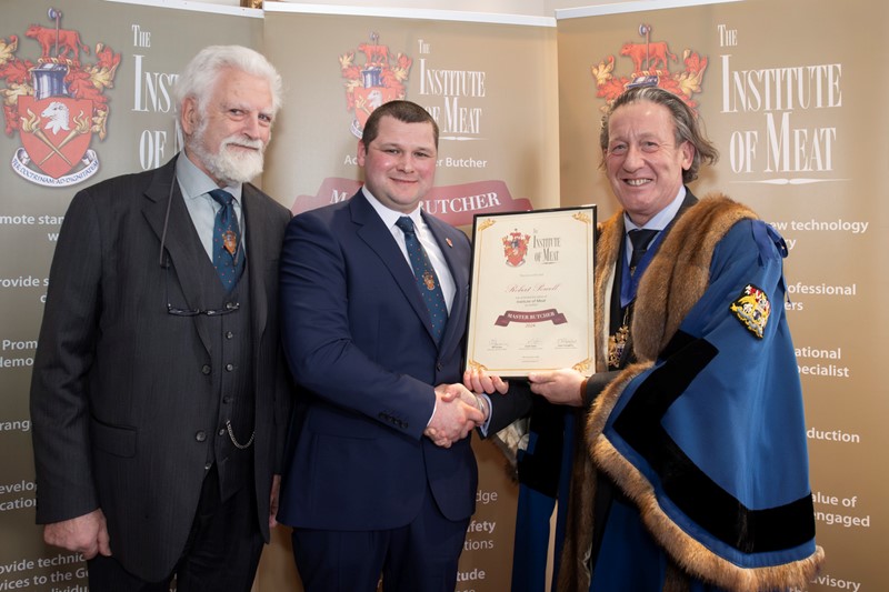 Rob Powell receiving his Master Butcher Award