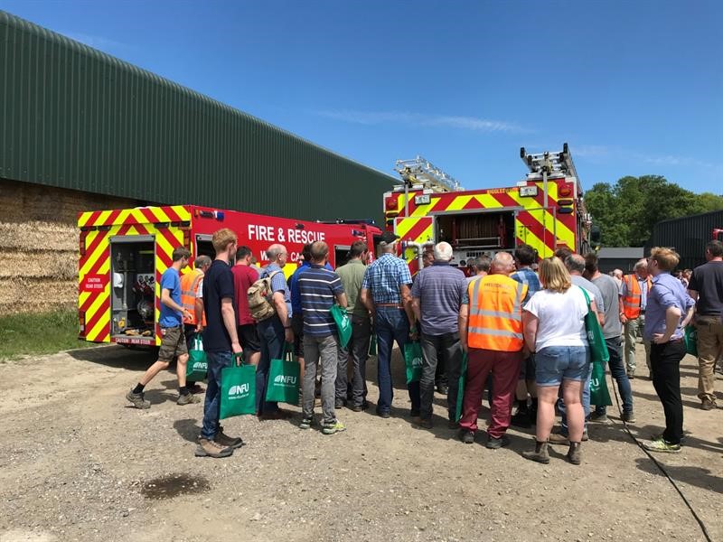 Farm safety event members on farm with the fire service