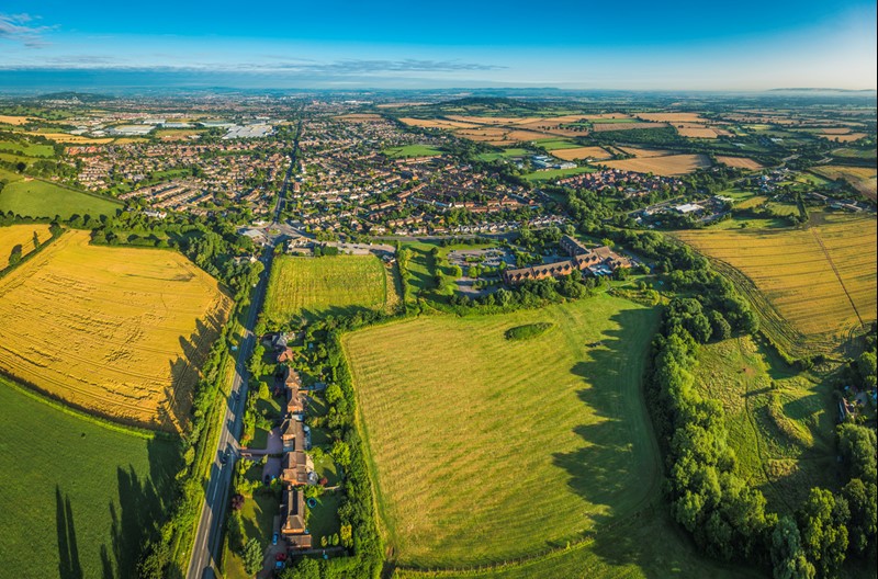 An image showing town and green belt