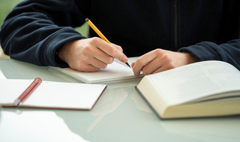 Person writing a letter