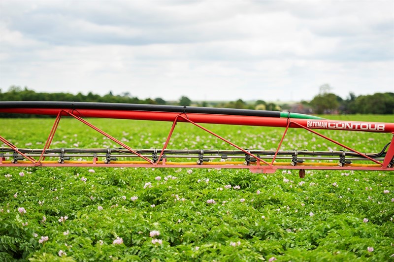 Crop sprayer in field