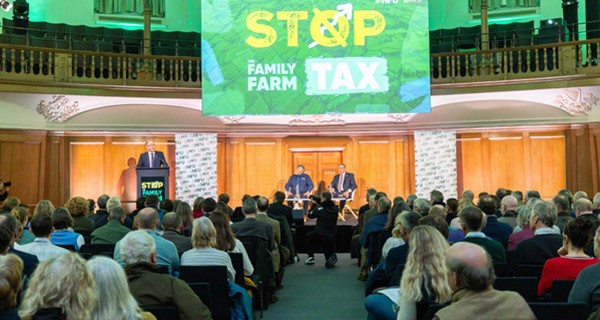 Tom on stage at the mass lobby infront of NFU members