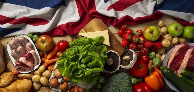 Multiple types of food on a table including vegetables and meat