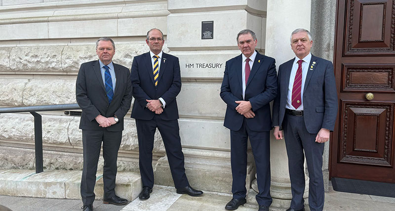 Four UK farming union presidents outside the Treasury