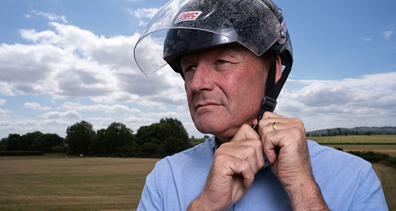 David Exwood putting on his helmet